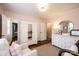Charming Bedroom with a crib, soft lighting, a cozy armchair, and neutral decor at 1571 10Th Street Nw Pl, Hickory, NC 28601