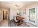 Inviting dining room with wooden table, upholstered chairs, and a decorative rug, adjacent to the kitchen at 1571 10Th Street Nw Pl, Hickory, NC 28601