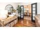 Beautiful foyer with wooden floors, decorative console table, and dining room view at 1571 10Th Street Nw Pl, Hickory, NC 28601
