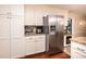 Bright kitchen with granite counters, stainless steel refrigerator, and ample cabinet space at 1571 10Th Street Nw Pl, Hickory, NC 28601