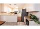 Bright kitchen with white cabinets, granite counters, stainless appliances, and hardwood floors at 1571 10Th Street Nw Pl, Hickory, NC 28601