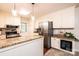 Well-appointed kitchen featuring granite countertops, stainless steel appliances, and wine cooler at 1571 10Th Street Nw Pl, Hickory, NC 28601