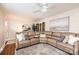 Inviting living room featuring a comfortable leather sectional, modern fan and stylish decor at 1571 10Th Street Nw Pl, Hickory, NC 28601