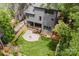 Aerial view of a backyard with a patio, fire pit, and wooden fence at 1625 Club Rd, Charlotte, NC 28205