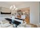 Elegant dining room with stylish lighting, connecting to a modern kitchen and living spaces at 1625 Club Rd, Charlotte, NC 28205