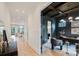 Inviting hallway leading to a naturally lit living room and a stylish office with a decorative ceiling at 1625 Club Rd, Charlotte, NC 28205