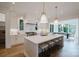Bright, spacious kitchen with a large island, modern appliances, and pendant lighting at 1625 Club Rd, Charlotte, NC 28205