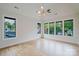 Bright room with many windows showing the neighborhood landscape and hardwood floors at 1625 Club Rd, Charlotte, NC 28205