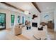 Stylish living room with exposed wooden beams, a fireplace, and modern furnishings at 1625 Club Rd, Charlotte, NC 28205