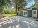 Spacious concrete patio with a lawn, trees, and a view of the home at 1720 Chatham Ave, Charlotte, NC 28205