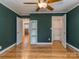 Open bedroom layout with shelving and a doorway view of the kitchen and bar at 1720 Chatham Ave, Charlotte, NC 28205