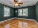 Spacious bedroom featuring hardwood floors and an overhead ceiling fan with light fixture at 1720 Chatham Ave, Charlotte, NC 28205