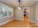 Dining room with hardwood floors, modern lighting, and view into the kitchen at 1720 Chatham Ave, Charlotte, NC 28205