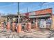 Busy brick building with outdoor seating, ideal for a lively market and deli experience at 1720 Chatham Ave, Charlotte, NC 28205