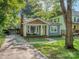 Charming home with a front porch, well-manicured lawn, and convenient driveway at 1720 Chatham Ave, Charlotte, NC 28205