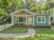 Charming single-story home featuring a welcoming front porch, well-maintained lawn, and inviting curb appeal at 1720 Chatham Ave, Charlotte, NC 28205