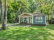 Inviting single-story home featuring a cozy front porch and lush green lawn at 1720 Chatham Ave, Charlotte, NC 28205