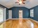 Spacious main bedroom with high ceilings, hardwood floors, ensuite access, and bright natural light at 1720 Chatham Ave, Charlotte, NC 28205