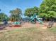 Vibrant playground featuring various structures, inviting children to enjoy outdoor fun and activity at 1720 Chatham Ave, Charlotte, NC 28205