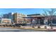 This image shows a restaurant with outside seating, plants, and a modern design in a bustling location at 1720 Chatham Ave, Charlotte, NC 28205