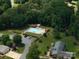 Overhead view of a community pool and neighborhood with mature trees at 1761 Arden Dr, Lincolnton, NC 28092