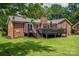 Cozy backyard with brick exterior and a deck to enjoy the scenic view at 1761 Arden Dr, Lincolnton, NC 28092