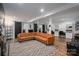 Finished basement with sectional couch, sliding barn doors, and recessed lighting at 1761 Arden Dr, Lincolnton, NC 28092
