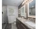 Bathroom with granite countertops, dual sinks, and tiled walk-in shower at 1761 Arden Dr, Lincolnton, NC 28092