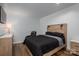 Modern bedroom with hardwood floors, a black bedspread, and updated furnishings at 1761 Arden Dr, Lincolnton, NC 28092