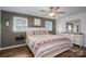 Comfortable bedroom featuring a ceiling fan, hardwood floors, and a decorative headboard at 1761 Arden Dr, Lincolnton, NC 28092