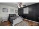 Bedroom with modern accents, dark accent wall, and light-colored furniture at 1761 Arden Dr, Lincolnton, NC 28092
