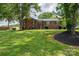 Traditional brick home with manicured front lawn and mature trees providing shade and curb appeal at 1761 Arden Dr, Lincolnton, NC 28092