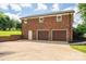 Spacious two-car garage in a charming brick house with a large driveway at 1761 Arden Dr, Lincolnton, NC 28092