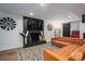 Comfortable living room with fireplace, TV, rustic decor, and a leather sectional sofa at 1761 Arden Dr, Lincolnton, NC 28092