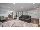 Spacious living room with hardwood floors, modern furniture, and a cozy atmosphere at 1761 Arden Dr, Lincolnton, NC 28092