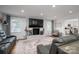 Inviting living room with a brick fireplace, plush seating, and wood floors at 1761 Arden Dr, Lincolnton, NC 28092
