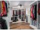 Walk-in closet with built-in shelving, hanging racks, and hardwood flooring at 1761 Arden Dr, Lincolnton, NC 28092