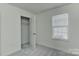 Clean bedroom with a closet, neutral walls, a plush carpet, and a window at 1890 Sandal Brook Rd, Fort Mill, SC 29707
