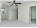 Bright bedroom featuring a ceiling fan, neutral walls, and plush carpeting at 1890 Sandal Brook Rd, Fort Mill, SC 29707