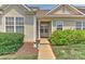 Charming townhome entrance with well-kept landscaping and a welcoming covered entryway at 1890 Sandal Brook Rd, Fort Mill, SC 29707