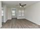 Open-concept living space with freshly painted walls and new flooring, bathed in light at 1890 Sandal Brook Rd, Fort Mill, SC 29707