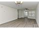Spacious living room with updated flooring, lots of light and modern ceiling fan at 1890 Sandal Brook Rd, Fort Mill, SC 29707