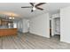 Open-concept living area with hardwood flooring connecting the kitchen and staircase at 1890 Sandal Brook Rd, Fort Mill, SC 29707