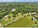 Aerial view of a property near a lake, showcasing a large open field at 2021 Beamguard Rd, Clover, SC 29710