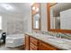 Bathroom with double sinks, granite countertops and a tub and shower combination at 2021 Beamguard Rd, Clover, SC 29710