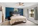 Bedroom features a plush bed, gray accent wall and modern ceiling fan at 2021 Beamguard Rd, Clover, SC 29710