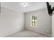Clean, carpeted room with bright window and minimalist design, ready for personal touches at 2021 Beamguard Rd, Clover, SC 29710