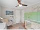 Adorable Bedroom with a white crib, rocking chair, and a decorative ceiling fan at 2021 Beamguard Rd, Clover, SC 29710