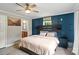 Bedroom features a dark accent wall, plush bed, and an attached bath suite at 2021 Beamguard Rd, Clover, SC 29710