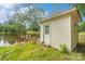 Exterior shot of home with a lakefront area and dock with lush greenery at 2021 Beamguard Rd, Clover, SC 29710